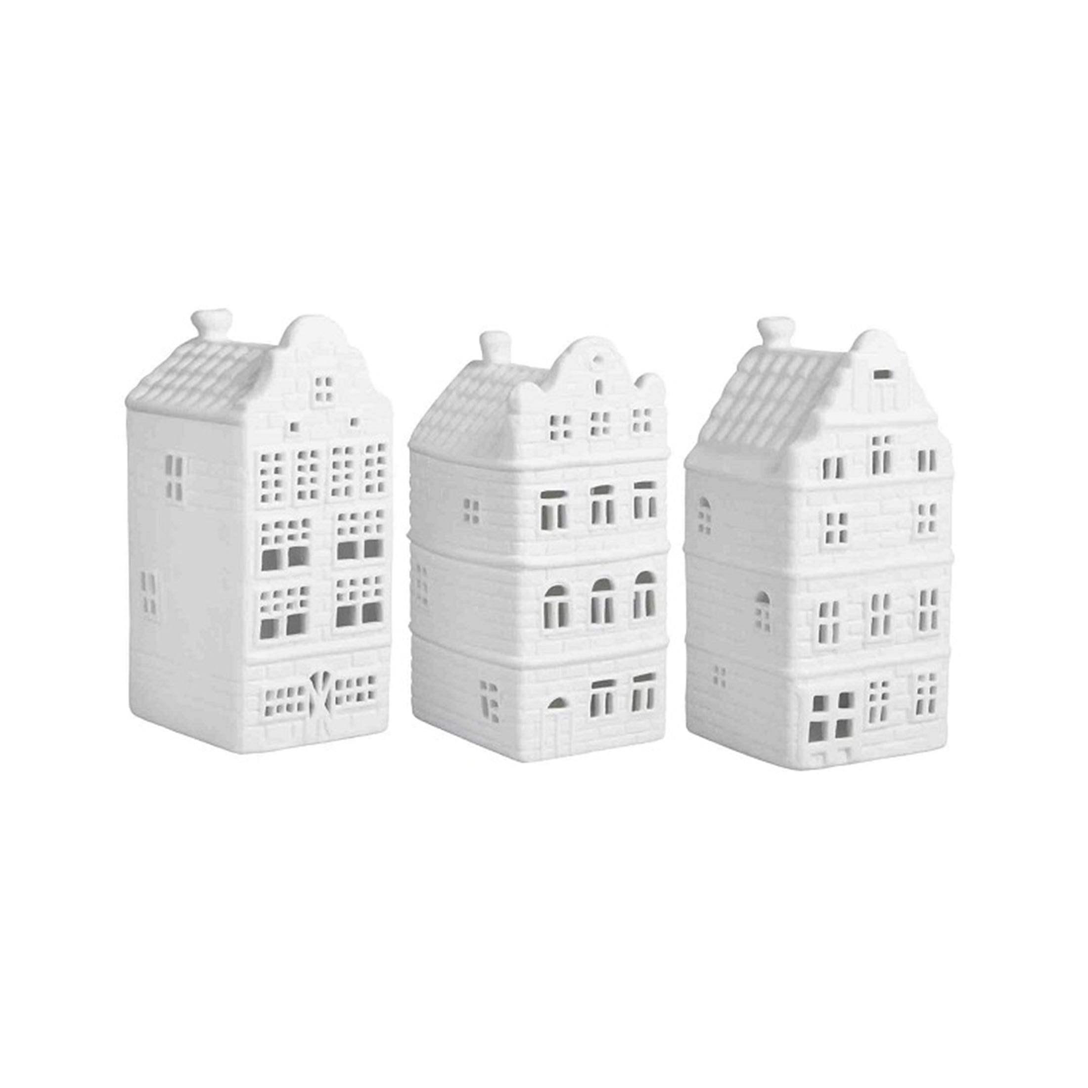 Teelichter in Hausform aus weißem Porzellan für die Dekoration im skandinavischen Wohnstil. Teelichter in der Form eines Haus in Amsterdam von der Marke Klevering
